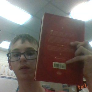A Scholastic Harry Potter  And The Sorcer's Stone by J.K. Rowling.